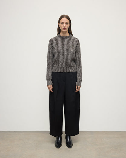 Model wearing Johnstons of Elgin AW25 Women's Knitwear Peregrine Donegal & Molasses High Neck Donegal Cashmere Brown Jumper Front View KAC05590Q25393