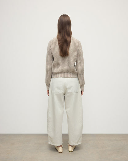 Model wearing Johnstons of Elgin AW25 Women's Knitwear Cream Dun Donegal & Ash High Neck Donegal Cashmere Cream Jumper Back View  KAC05590Q25394