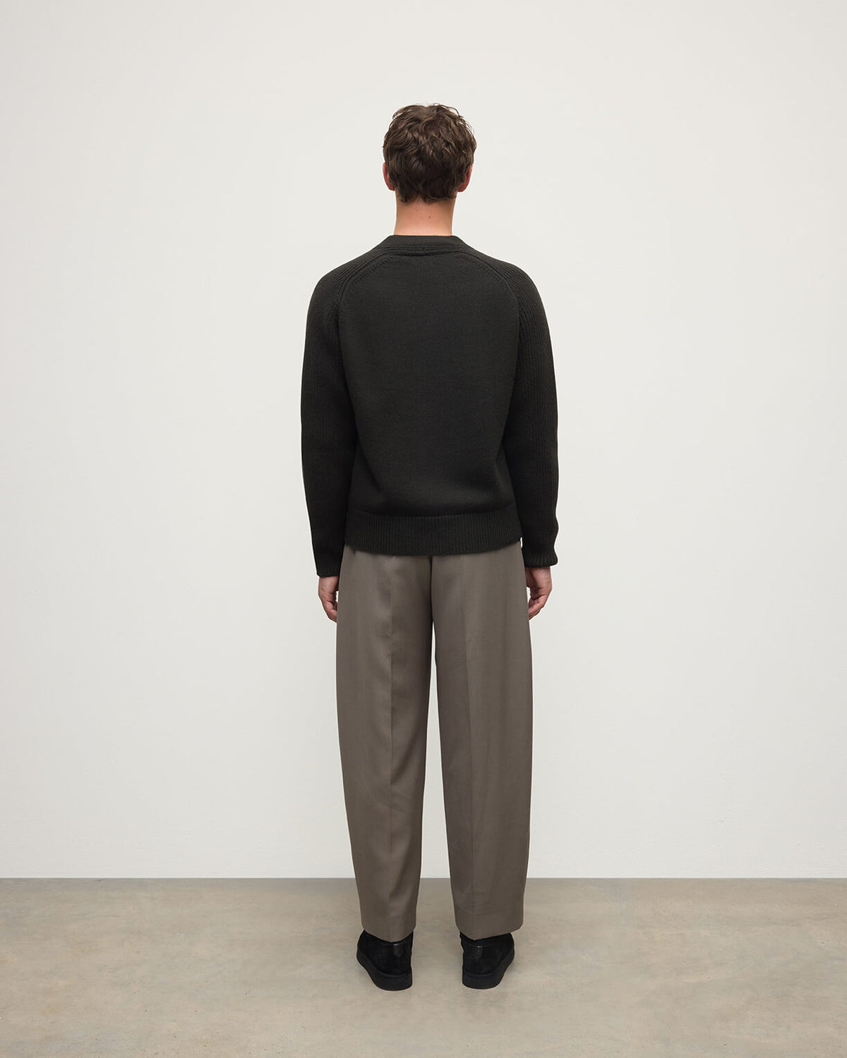 Model wears Johnstons of Elgin AW25 Men's Knitwear Iron Ribbed Cashmere Grey Cardigan Back KAC05601SC7330