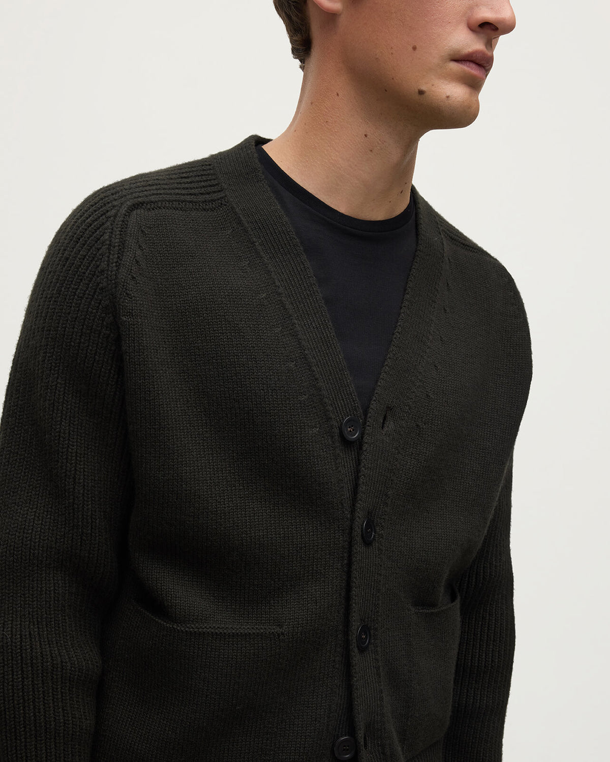 Model wears Johnstons of Elgin AW25 Men's Knitwear Iron Ribbed Cashmere Grey Cardigan details KAC05601SC7330