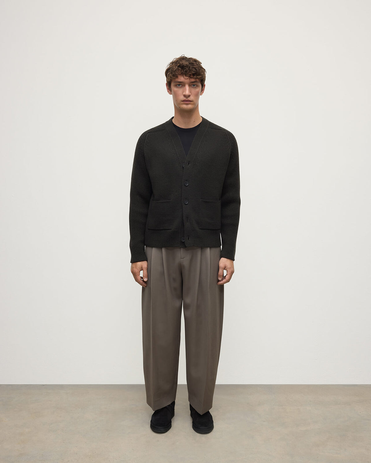 Model wears Johnstons of Elgin AW25 Men's Knitwear Iron Ribbed Cashmere Grey Cardigan Front KAC05601SC7330