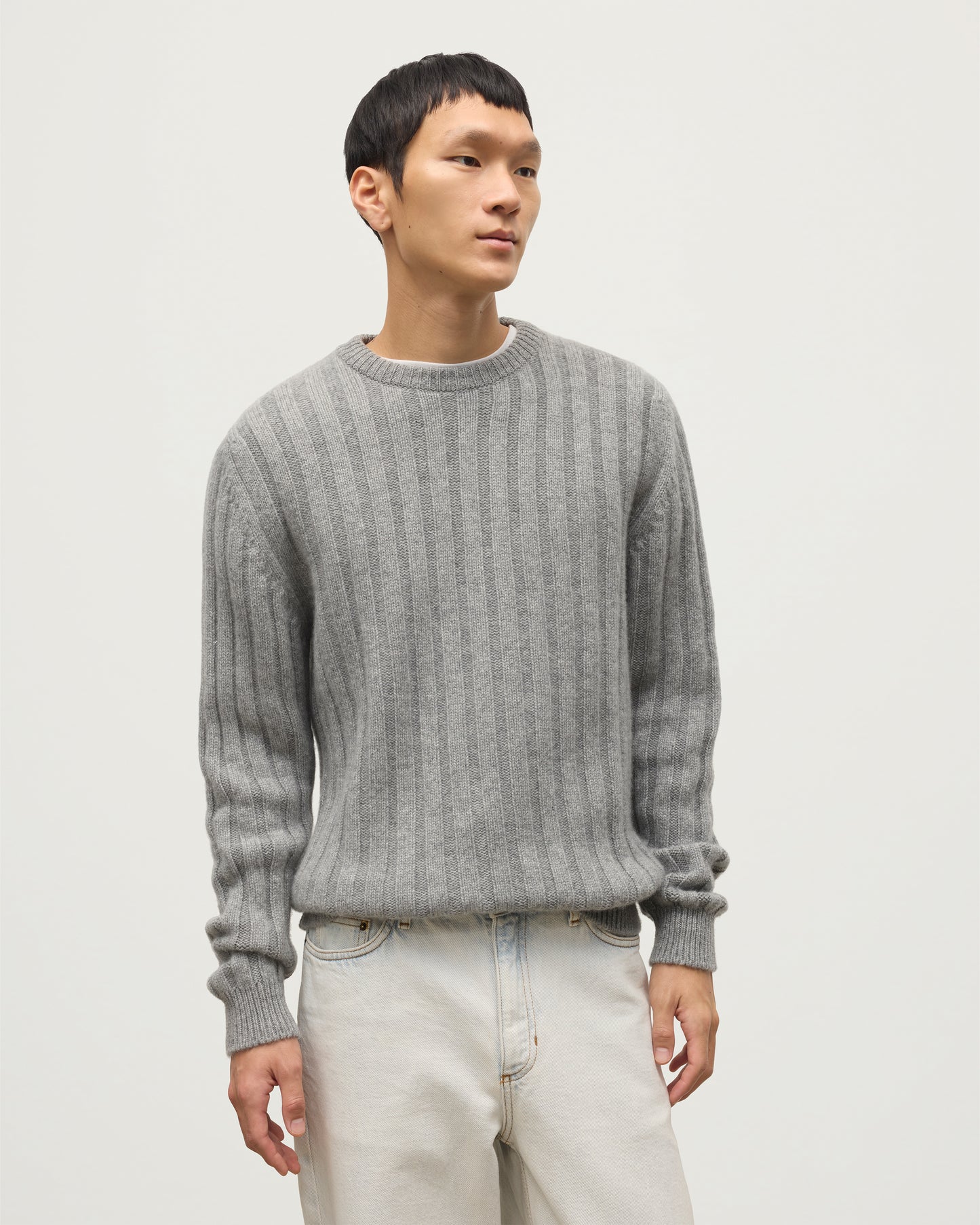 JOHNSTONS OF ELGIN MENS PEEL CREW SWEATER GREY 100% CASHMERE OVER A WHITE T-SHIRT WITH WHITE JEANS AND BLACK LOAFERS KAC05751HA0400