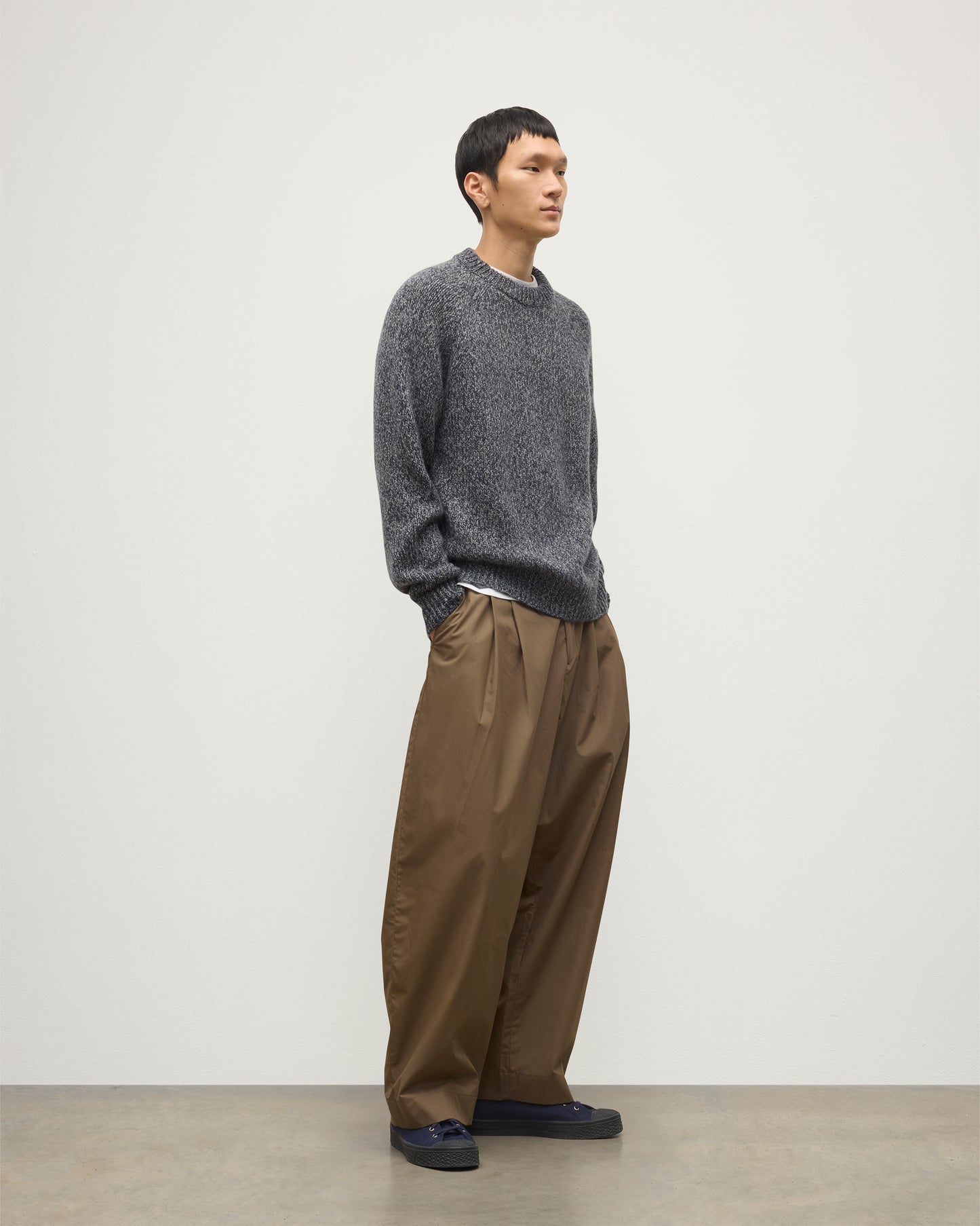MALE MODEL WEARS JOHNSTONS OF ELGIN FYFE CREW SWEATER NAVY 100% CASHMERE OVER WHITE T-SHIRT AND BROWN TROUSERS  KAC05753006876