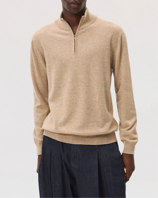 Model wearing Johnstons of Elgin SS25 Men's Knitwear Oatmeal Classic Cashmere Zip Neck on a white background  KAI05151HB0210
