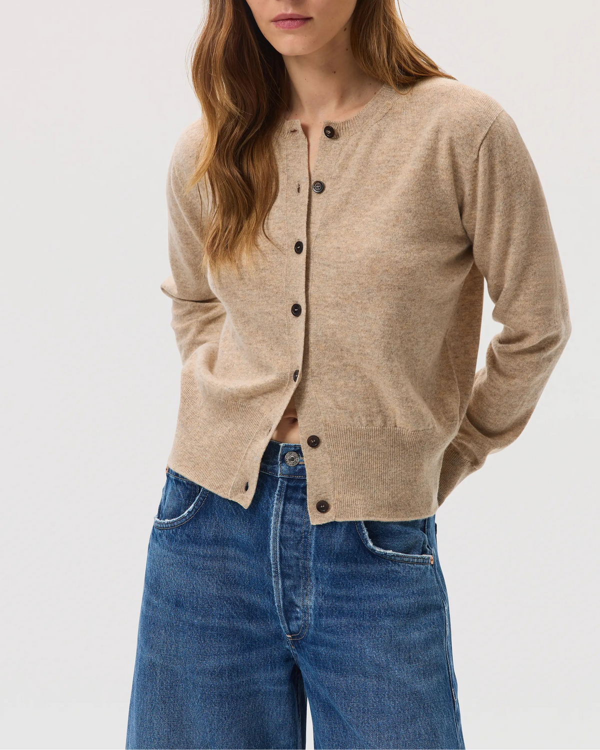 Model wearing Johnstons of Elgin SS25 Women's Knitwear Oatmeal Classic Cashmere Cardigan on a white backdrop KAI05274HB0210