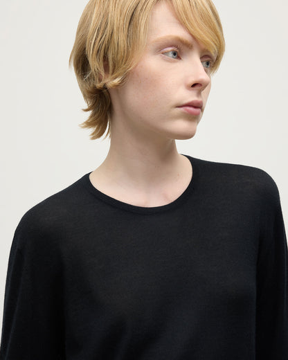 Model wearing Johnstons of Elgin AW25 Women's Knitwear Black Superfine Cashmere Black Jumper Close Up KAI05318SA7146