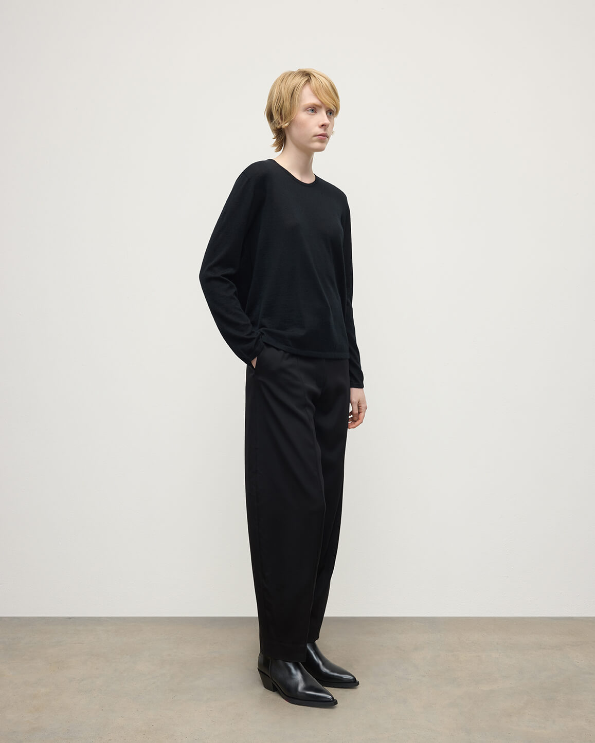 Model wearing Johnstons of Elgin AW25 Women's Knitwear Black Superfine Cashmere Black Jumper Side View KAI05318SA7146