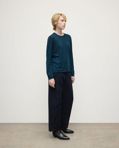 Model wearing Johnstons of Elgin AW25 Women's Knitwear Bottle Green Superfine Cashmere Green Jumper Side View KAI05318SC7344