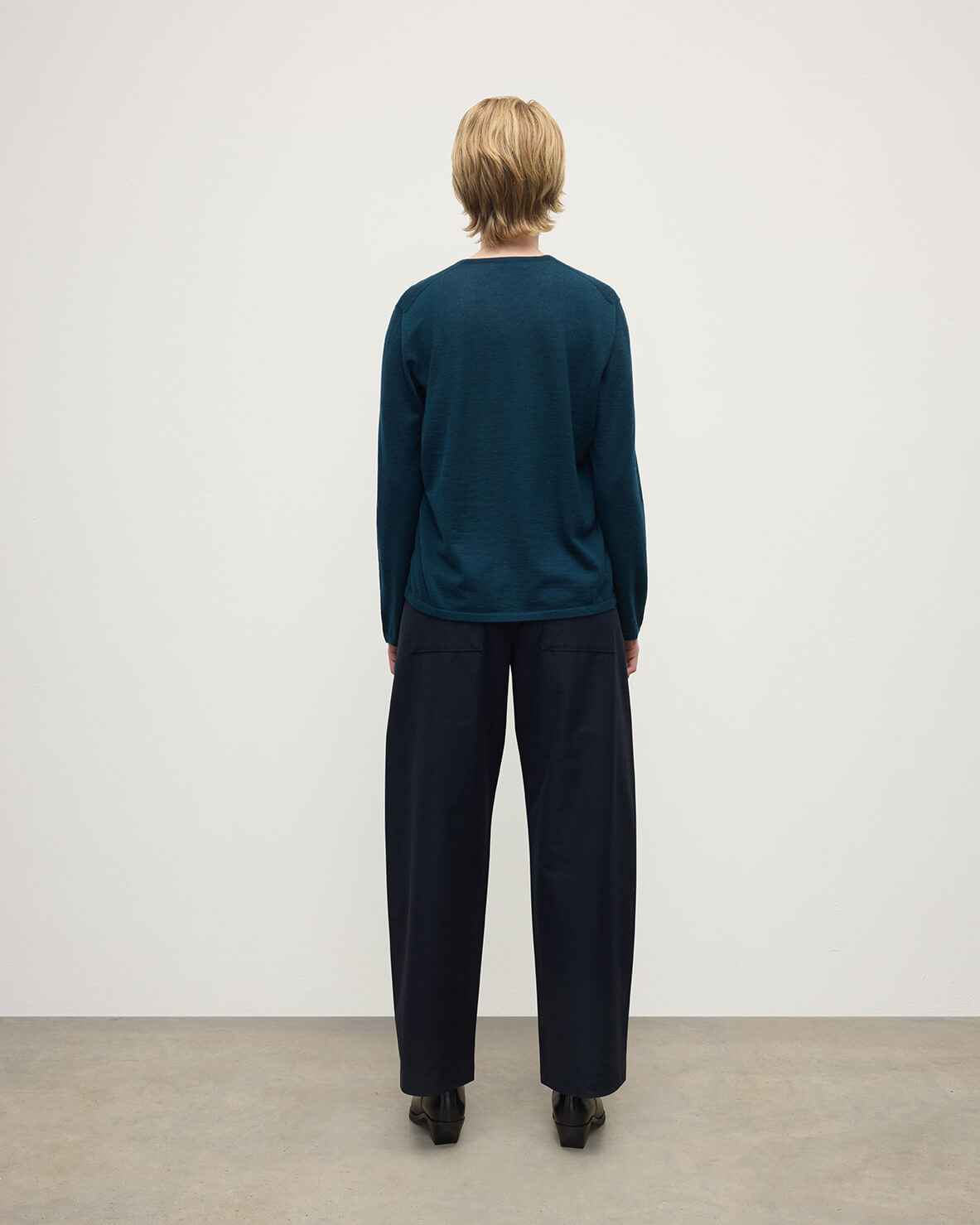 Model wearing Johnstons of Elgin AW25 Women's Knitwear Bottle Green Superfine Cashmere Green Jumper Back View KAI05318SC7344