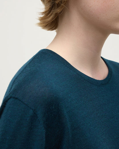 Model wearing Johnstons of Elgin AW25 Women's Knitwear Bottle Green Superfine Cashmere Green Jumper neckline detail KAI05318SC7344