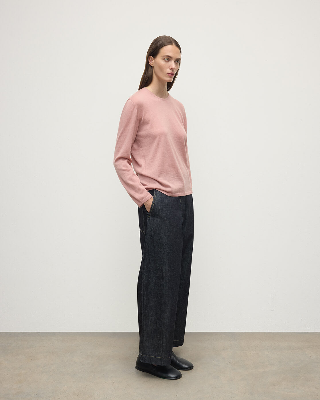 Model wearing Johnstons of Elgin AW25 Women's Knitwear Nude Superfine Cashmere Pink Jumper Side View KAI05318SE5274