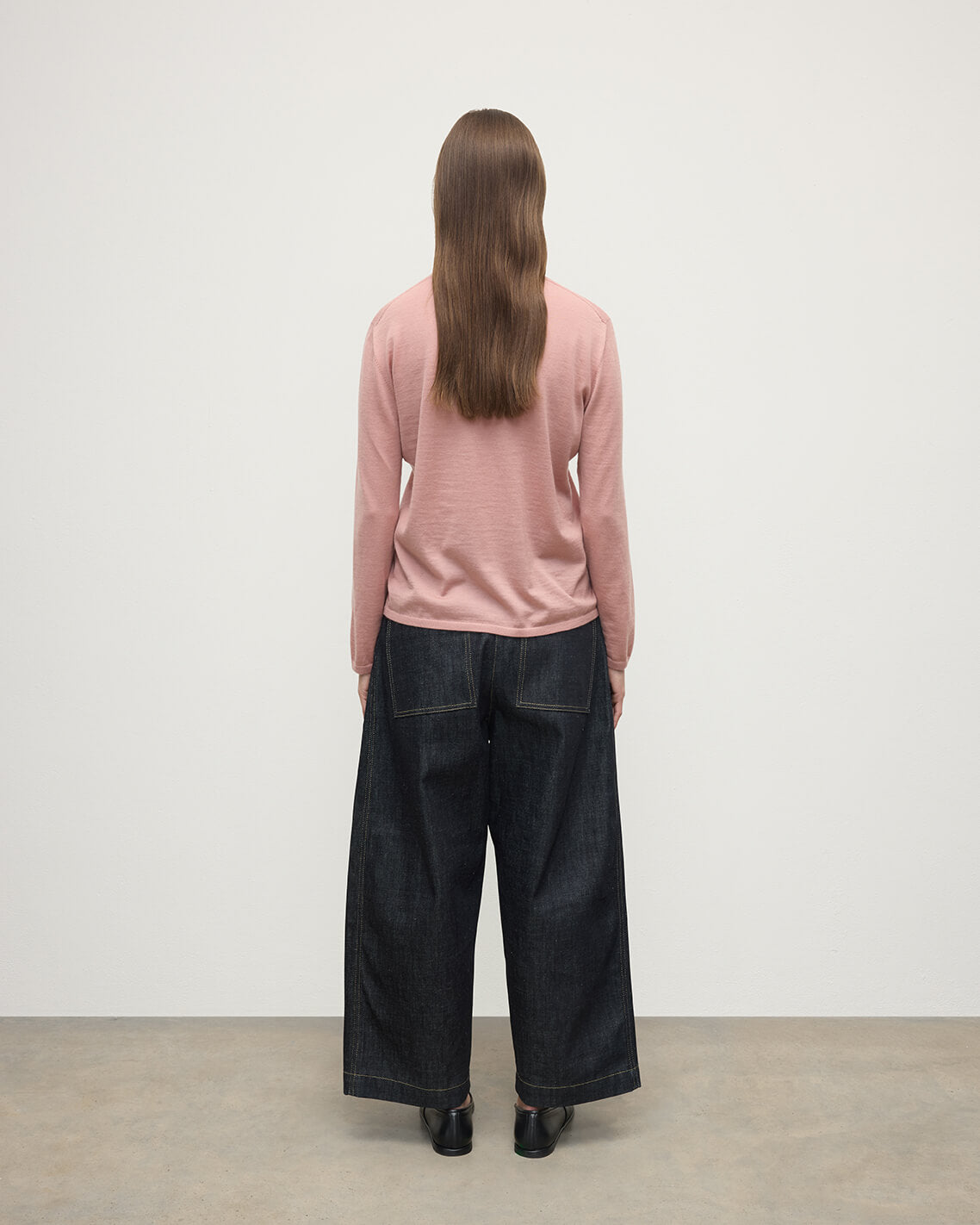 Model wearing Johnstons of Elgin AW25 Women's Knitwear Nude Superfine Cashmere Pink Jumper Back View KAI05318SE5274