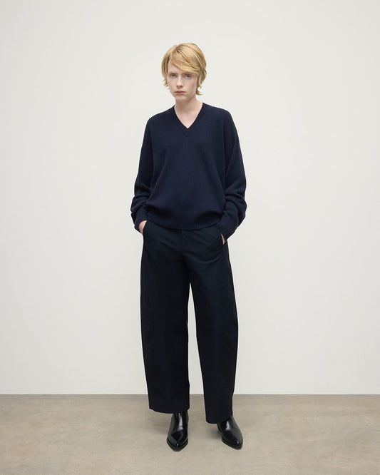 Model wearing Johnstons of Elgin AW25 Women's Knitwear Dark Navy Gauzy Cashmere Navy V Neck Jumper Front View KAI05323SD7666