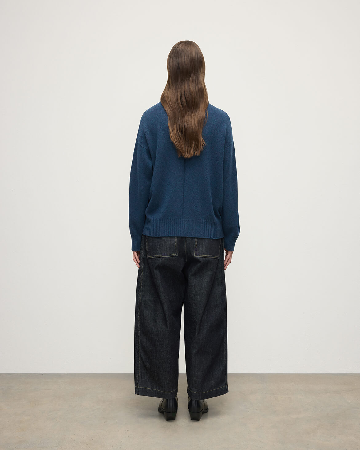 Model wears Johnstons of Elgin AW25 Women's Knitwear Heather Navy Gauzy Cashmere Roll Neck Back View KAI05324HD7321