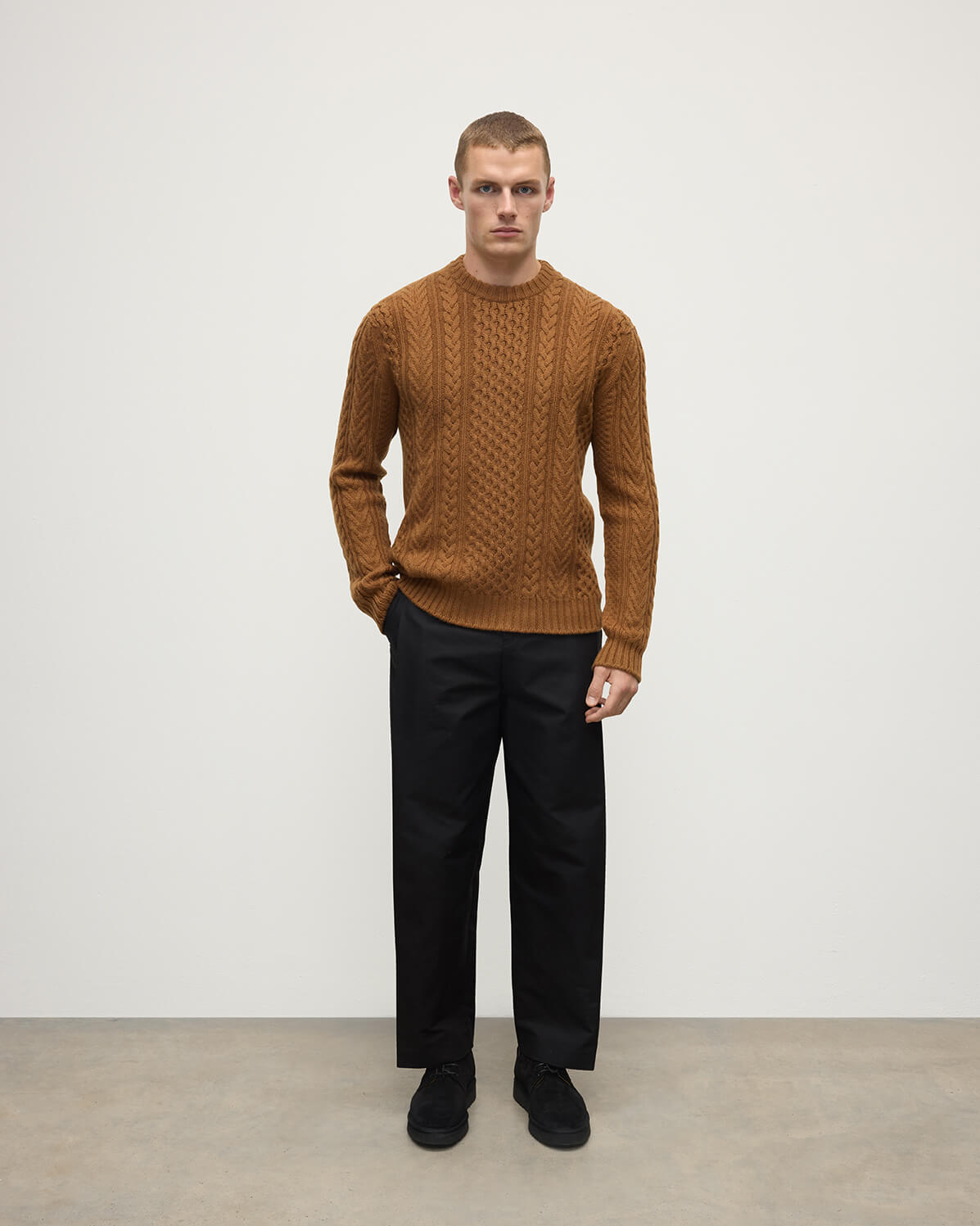 Front view of model wearing Johnstons of Elgin AW25 Men's Knitwear Dark Camel Aran Cable Camel Cashmere Jumper KAI05336SB4620