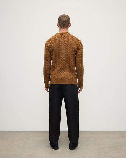 Back view of model wearing Johnstons of Elgin AW25 Men's Knitwear Dark Camel Aran Cable Camel Cashmere Jumper KAI05336SB4620