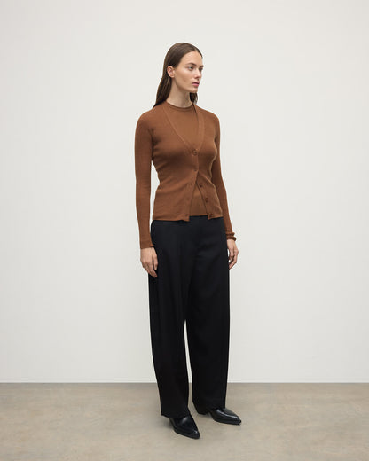 Model wearing Johnstons of Elgin AW25 Women's Knitwear Dark Camel Superfine Cashmere Camel Cardigan Side View KAI05372SB7300