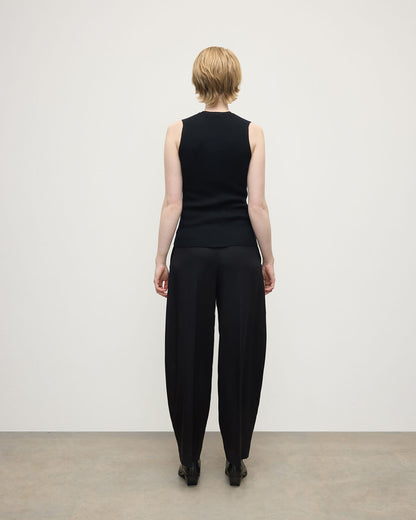 model wears Johnstons of Elgin AW25 Women's Knitwear Black Sleeveless Black Tank Top back view KAI05559SA7146
