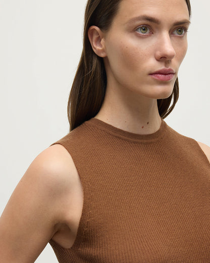 Model wears Johnstons of Elgin AW25 Women's Knitwear Dark Camel Sleeveless Camel Tank Top armhole details KAI05559SB7300