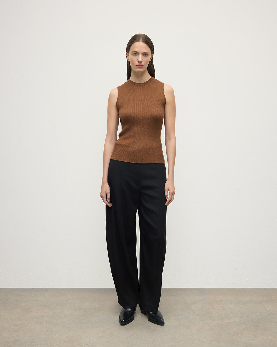 Model wears Johnstons of Elgin AW25 Women's Knitwear Dark Camel Sleeveless Camel Tank Top Front View KAI05559SB7300