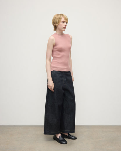 model wears Johnstons of Elgin AW25 Women's Knitwear Nude Sleeveless Pink Tank Top Side View KAI05559SE5274