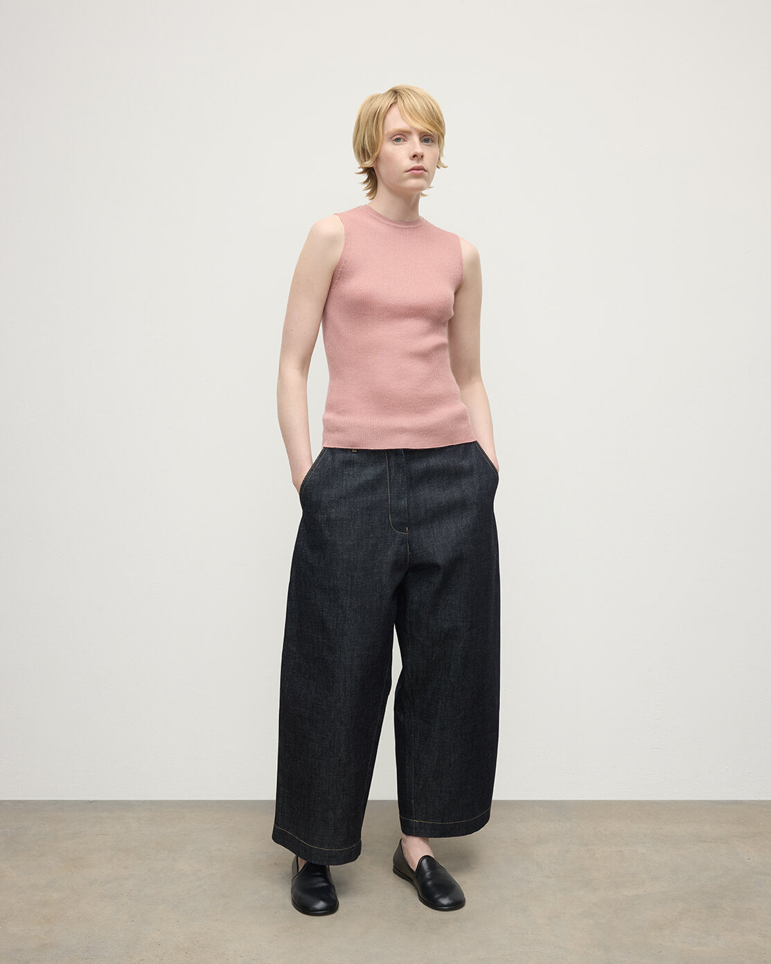 model wears Johnstons of Elgin AW25 Women's Knitwear Nude Sleeveless Pink Tank Top Front View KAI05559SE5274