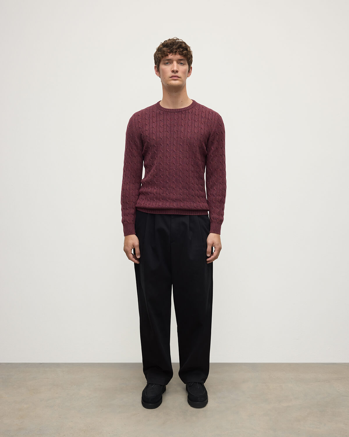 Model wears Johnstons of Elgin AW25 Men's Knitwear Damson Cable Knit Cashmere Jumper Front  KAI05693HE7064