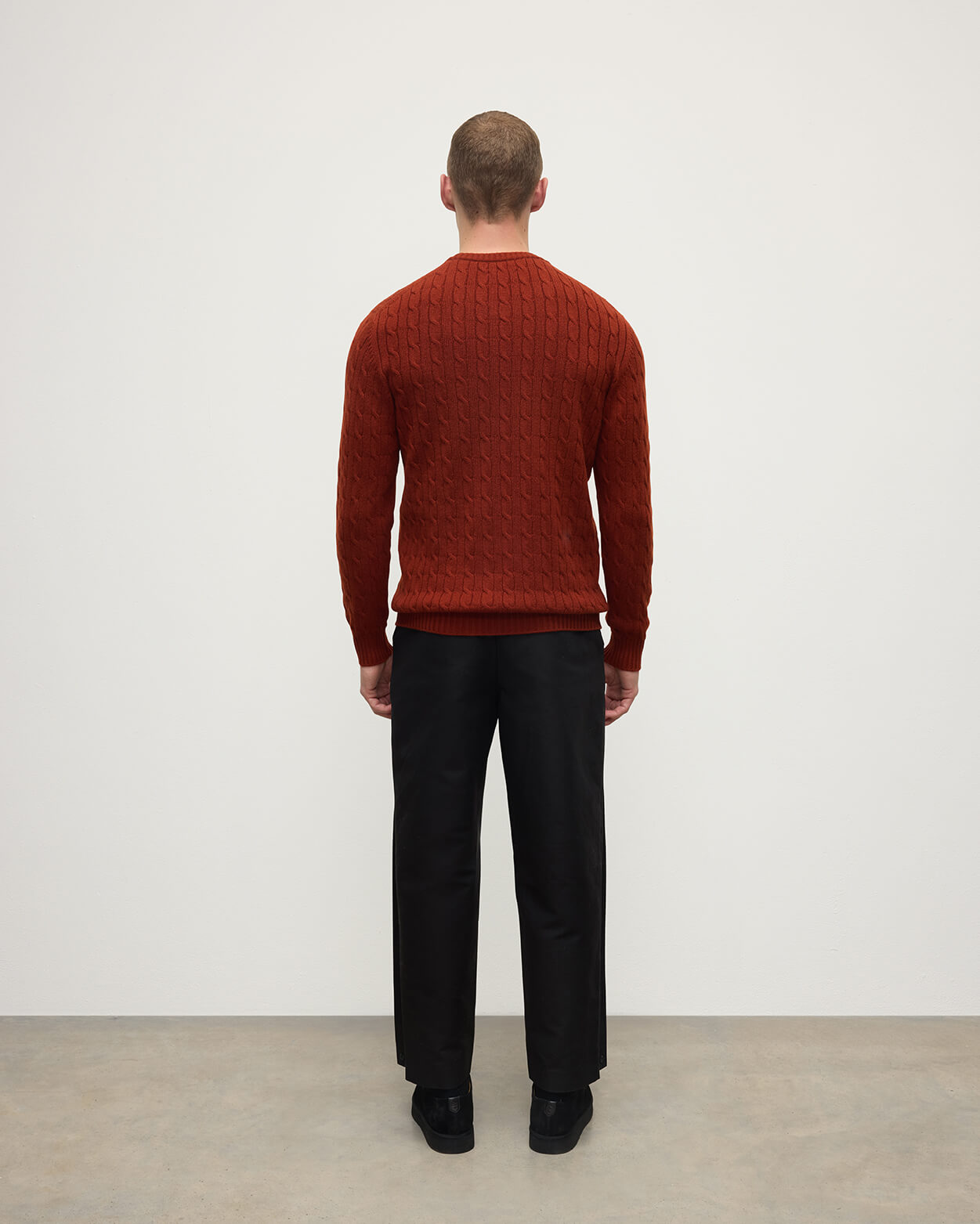 Model wearing Johnstons of Elgin AW25 Men's Knitwear Oxblood Cable Knit Red Cashmere Jumper Back KAI05693SG4463