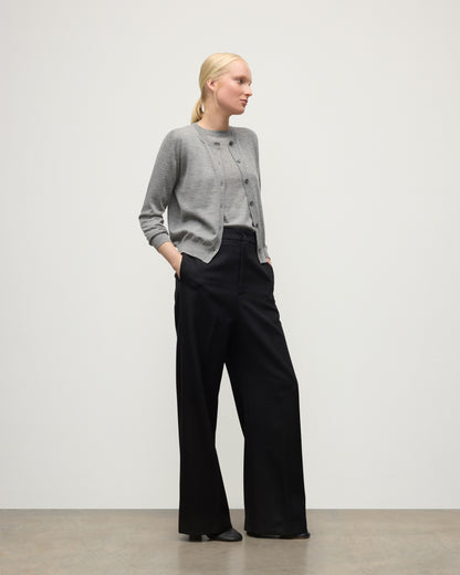 MODEL WEARING JOHNSTONS OF ELGIN WOMENS HONOR CREW CARDIGAN GREY 100% SUPERFINE CASHMERE OVER A MATCHING T-SHIRT WITH BLACK TROUSERS KAI05708HA4253