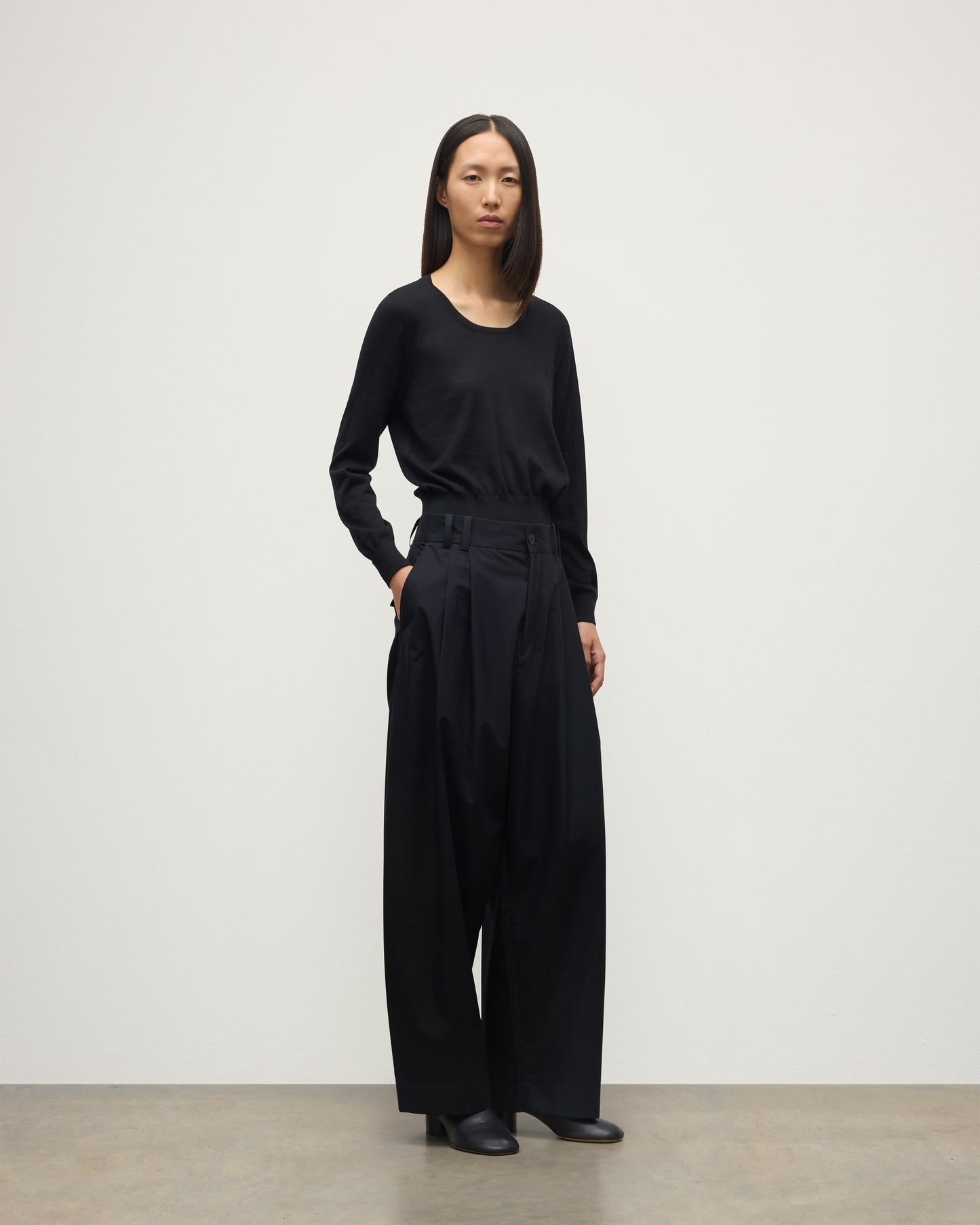 MODEL WEARING JOHNSTONS OF ELGIN WOMENS ELLA SCOOP SWEATER BLACK WITH BLACK TROUSERS KAI05723SA7146