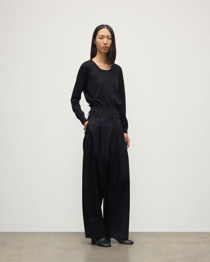 MODEL WEARING JOHNSTONS OF ELGIN WOMENS ELLA SCOOP SWEATER BLACK WITH BLACK TROUSERS KAI05723SA7146