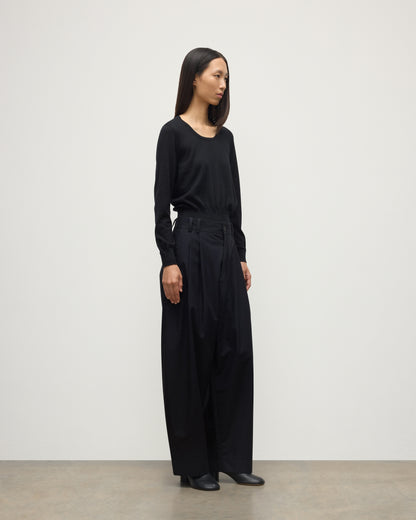 MODEL WEARING JOHNSTONS OF ELGIN WOMENS ELLA SCOOP SWEATER BLACK WITH BLACK TROUSERS KAI05723SA7146