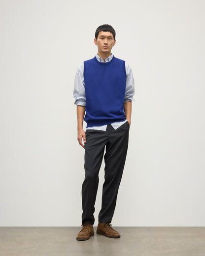 MENS LENNOX SLEEVELESS CREW BLUE 100% CASHMERE, BY JOHNSTONS OF ELGIN, WORN OVER A LIGHT BLUE SHIRT WITH NAVY PANTS KAP05243SD5326