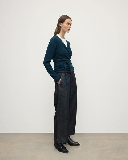 Model wearing Johnstons of Elgin AW25 Women's Knitwear Bottle Green Ballet Wrap Green Cashmere Cardigan Side View KAP05408SC7341