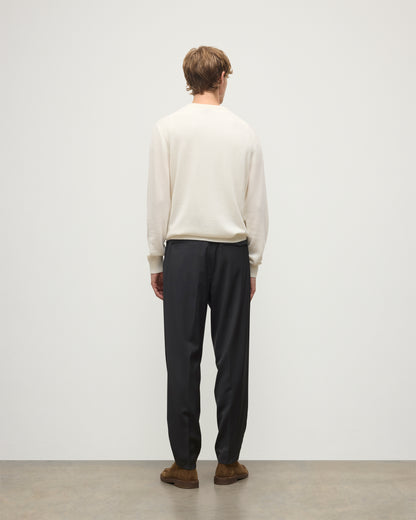 MODEL WEARS JOHNSTONS OF ELGIN MENS RORY CREW CLASSIC JUMPER WHITE 100% CASHMERE WITH GREY TROUSERS AND BROWN BELT AND SHOES KAP05471SA0606
