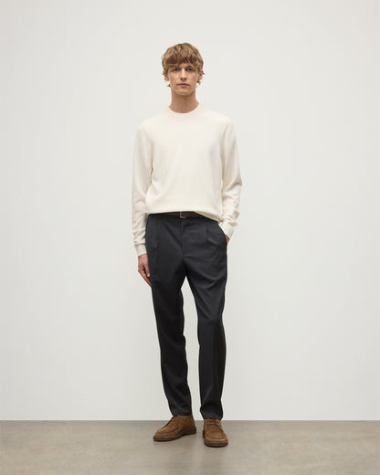 MODEL WEARS JOHNSTONS OF ELGIN MENS RORY CREW CLASSIC JUMPER WHITE 100% CASHMERE WITH GREY TROUSERS AND BROWN BELT AND SHOES KAP05471SA0606