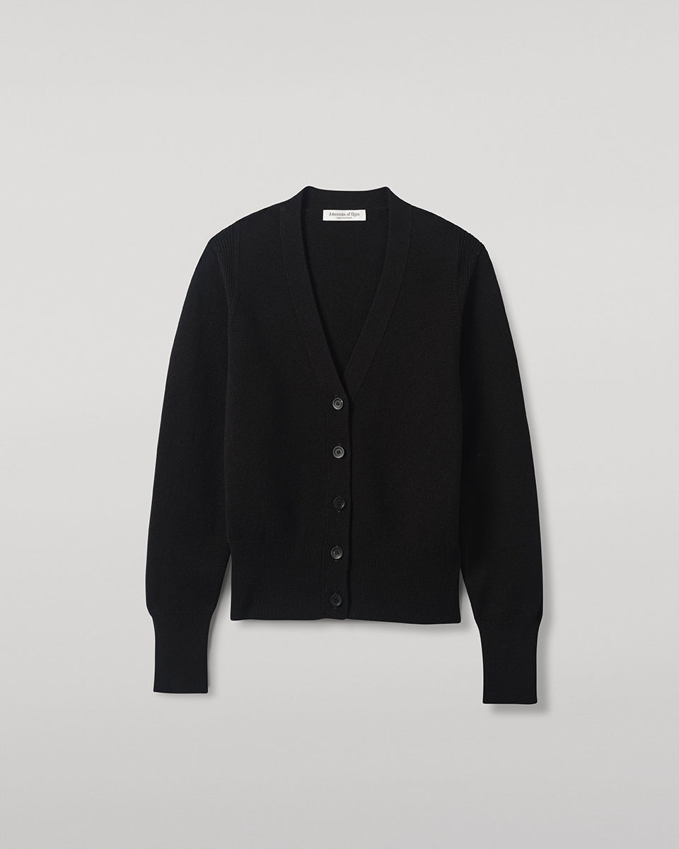 Model wears Johnstons of Elgin  Women's Knitwear Black Milano Stitch Black Cashmere Cardigan over a white shirt Front View KAP05489SA7210