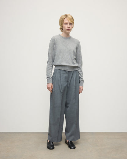 Model wears Johnstons of Elgin AW25 Women's Knitwear Light Grey Classic Cashmere Grey Round Neck Jumper Front KAP05572HA0308