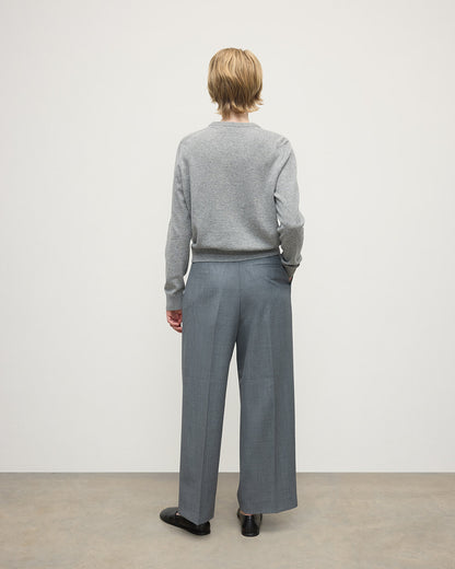 Model wears Johnstons of Elgin AW25 Women's Knitwear Light Grey Classic Cashmere Grey Round Neck Jumper Back KAP05572HA0308