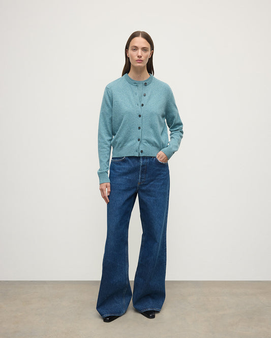 Model wears Johnstons of Elgin AW25 Women's Knitwear Seascape Classic Cashmere Green Cardigan Front KAP05573HC0038