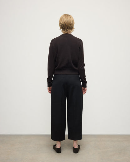 Model wears Johnstons of Elgin AW25 Women's Knitwear Molasses Classic Cashmere Brown Cardigan Back KAP05573SB7290