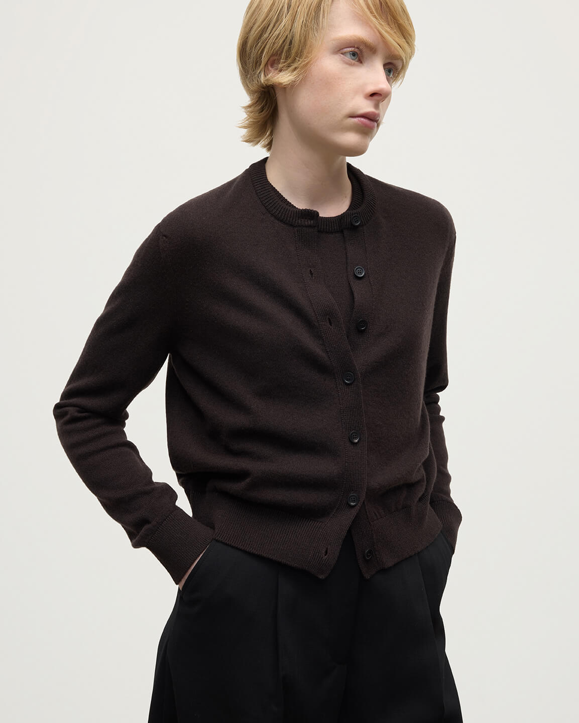 Model wears Johnstons of Elgin AW25 Women's Knitwear Molasses Classic Cashmere Brown Cardigan Close Up KAP05573SB7290