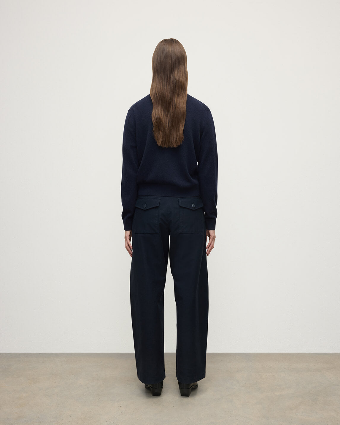 Model wears Johnstons of Elgin AW25 Women's Knitwear Dark Navy Classic Cashmere Navy Cardigan Back KAP05573SD7666