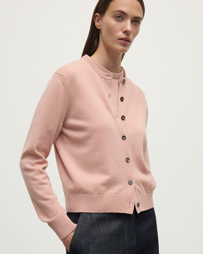 Model wears Johnstons of Elgin AW25 Women's Knitwear Nude Classic Cashmere Pink Cardigan Close Up KAP05573SE0740