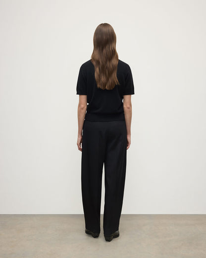 Model wearing Johnstons of Elgin AW25 Women's Knitwear Black Classic Cashmere Black T-shirt Back KAP05574SA7210