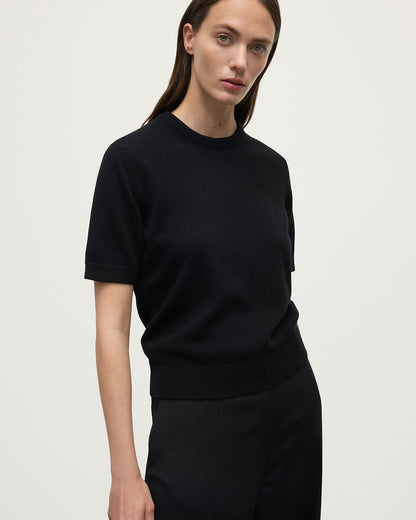 Model wearing Johnstons of Elgin AW25 Women's Knitwear Black Classic Cashmere Black T-shirt Close Up KAP05574SA7210