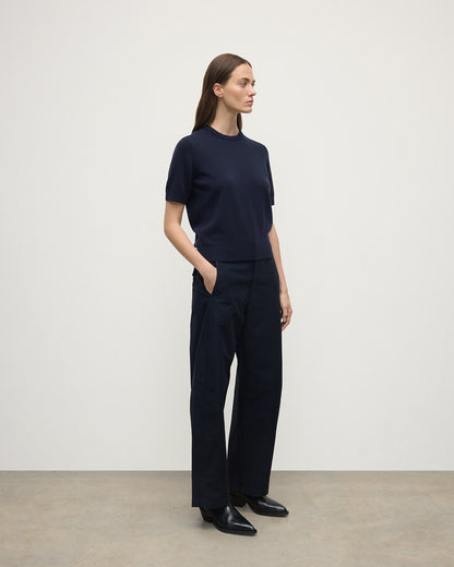 Model wearing Johnstons of Elgin AW25 Women's Knitwear Dark Navy Classic Cashmere Navy T-shirt Side View KAP05574SD7666