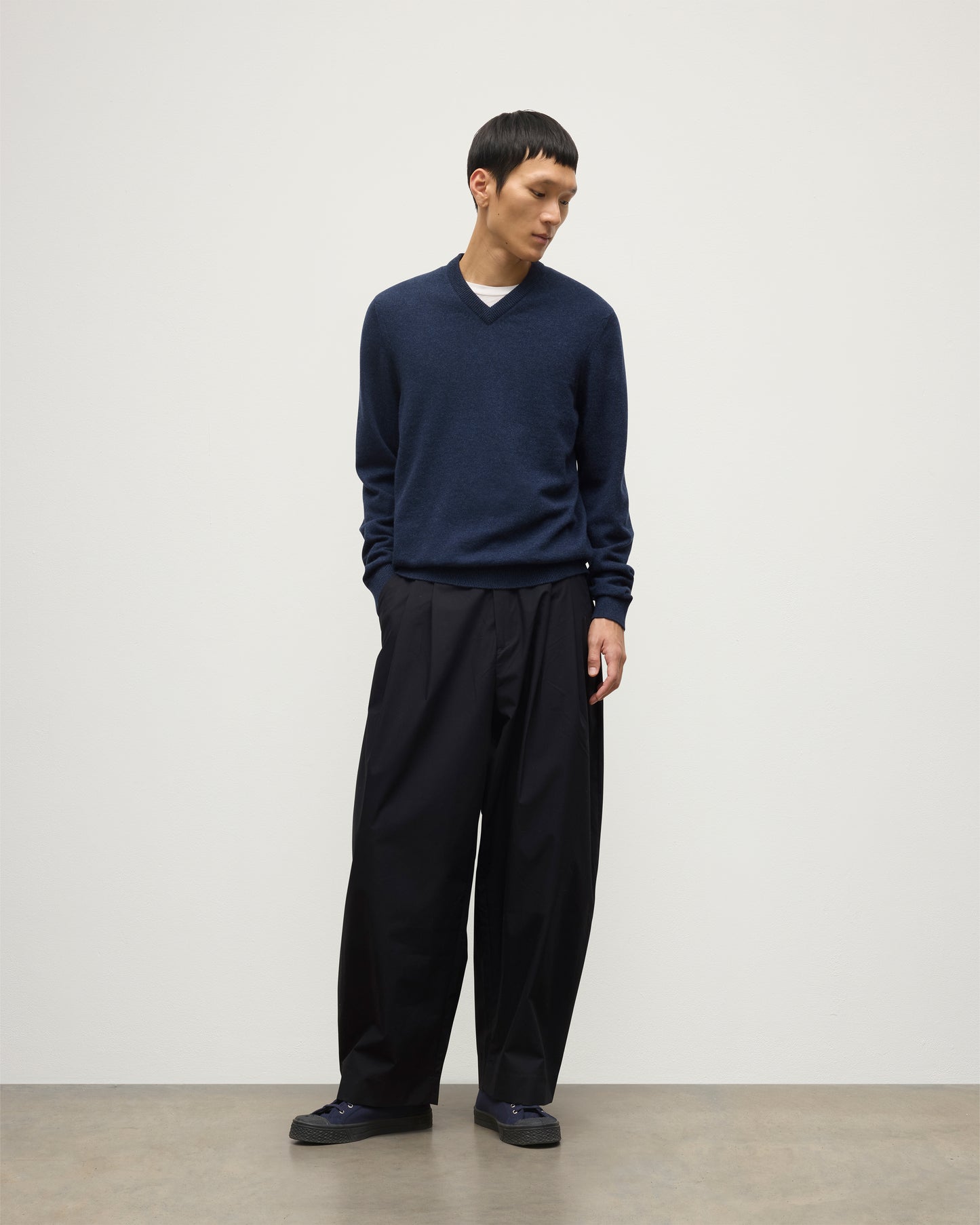 MODEL WEARS JOHNSTONS OF  ELGIN MENS RORY VEE NECK CLASSIC JUMPER 100% CASHMERE WITH NAVY TROUSERS KAP05594HD7350