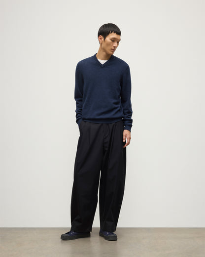 MODEL WEARS JOHNSTONS OF  ELGIN MENS RORY VEE NECK CLASSIC JUMPER 100% CASHMERE WITH NAVY TROUSERS KAP05594HD7350