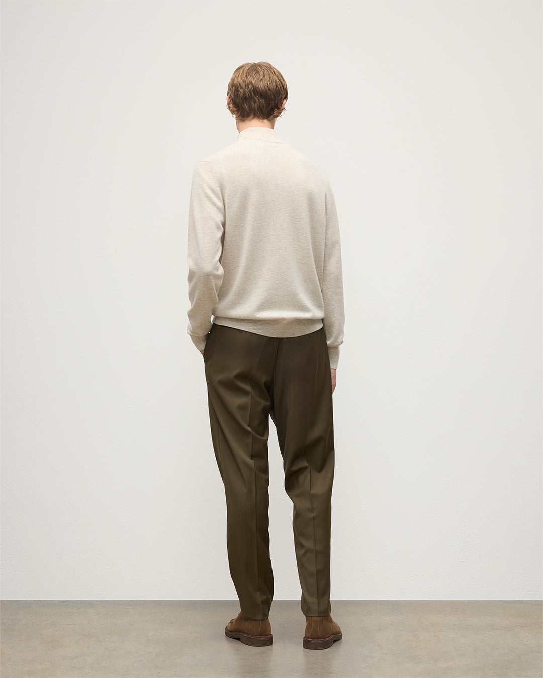 MODEL WEARING JOHNSTONS OF ELGIN MENS RORY CLASSIC HALF ZIP CLASSIC SWEATER 100% CASHMERE WITH OLIVE GREEN TROUSERS KAP05695HA0402